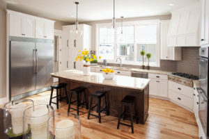 A remodeled kitchen with double-hung windows over the sink.